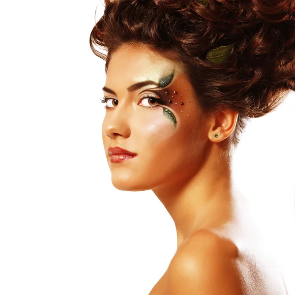 Portret van jonge mooie vrouw met ecologie thema make-up Stockfoto