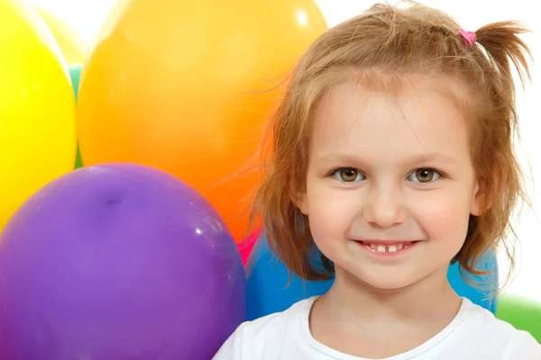 Portrait of little girl with color balloons Stock Image