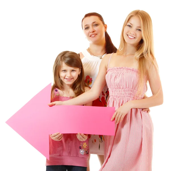 Mother with two daughters holding pink arrow — Stock Photo, Image