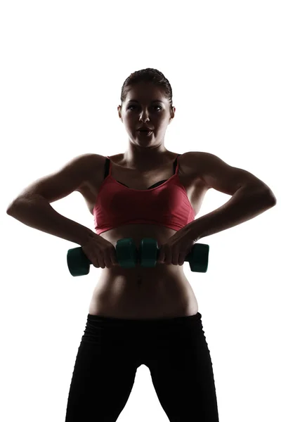 Girl doing hands and legs with dumbbells — Stock Photo, Image