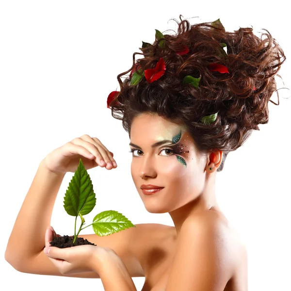 Teen girl with green tree shoot — Stock Photo, Image