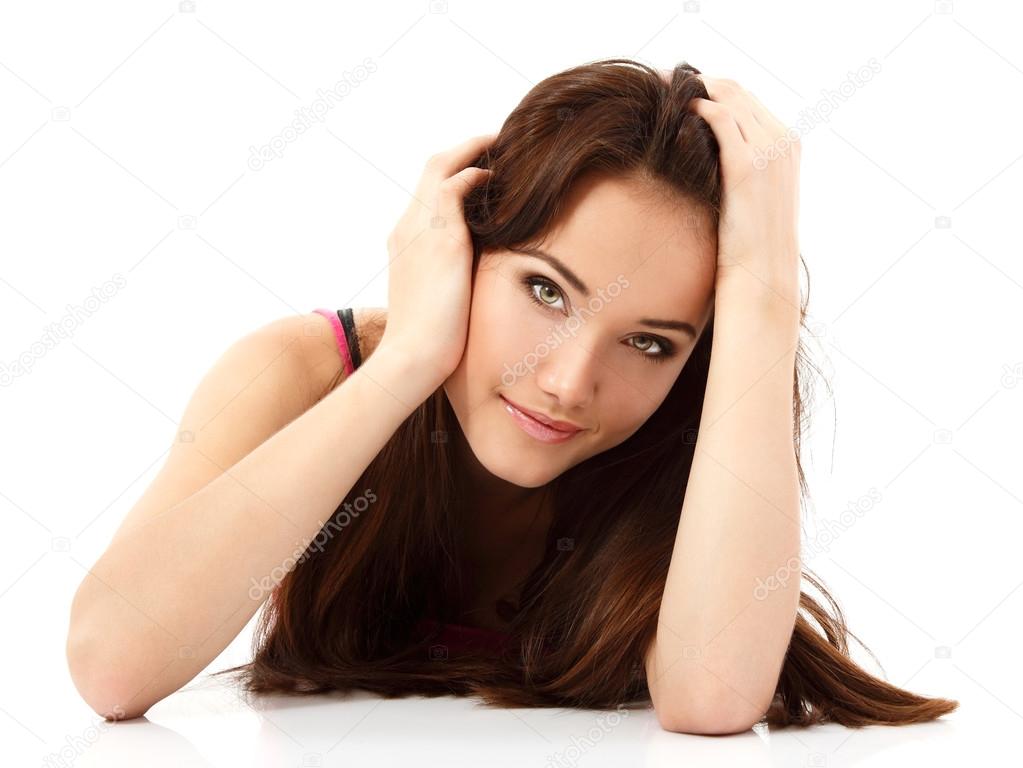 Young woman lying and looking at camera