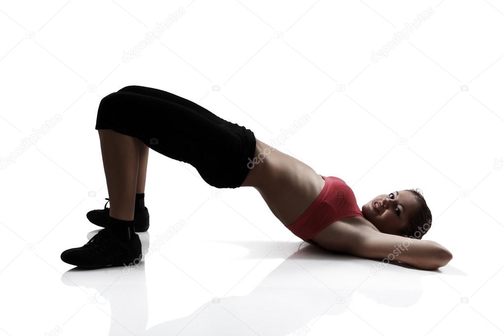 Girl doing exercise for legs and buttocks