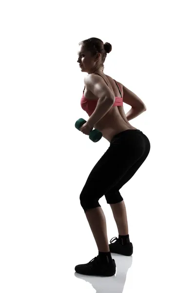 Mujer haciendo sentadillas con mancuernas —  Fotos de Stock