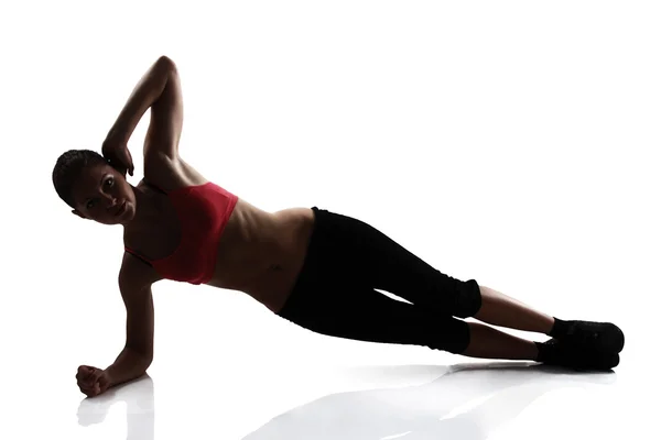 Girl doing arms and legs exercise — Stock Photo, Image