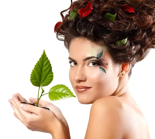 Teen girl with green tree Royalty Free Stock Images