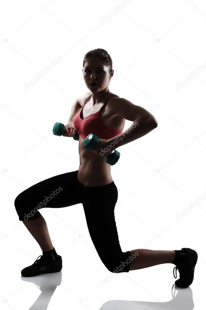 Athletic woman doing squatting
