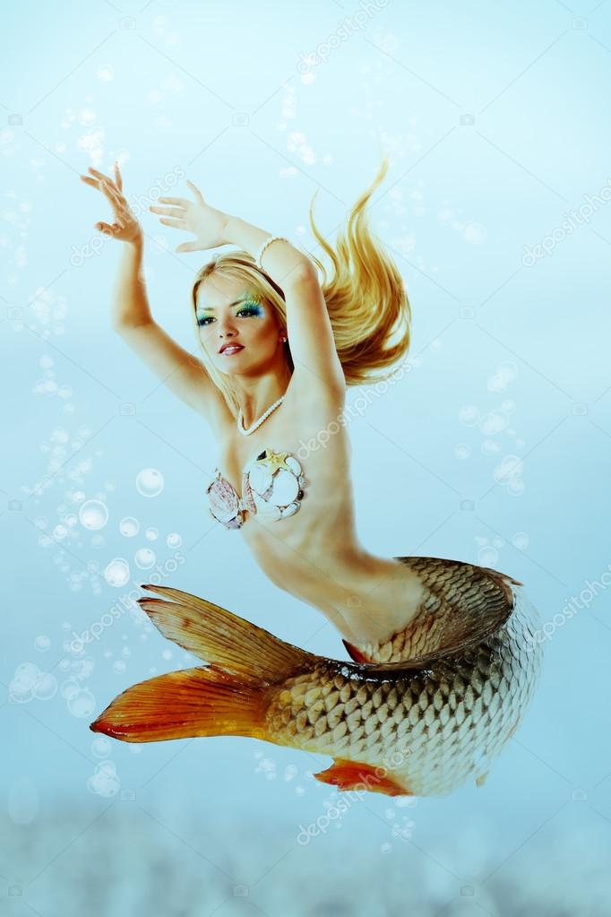 Beautiful mermaid girl with fish tail Stock Photo by ©khorzhevska 38400773