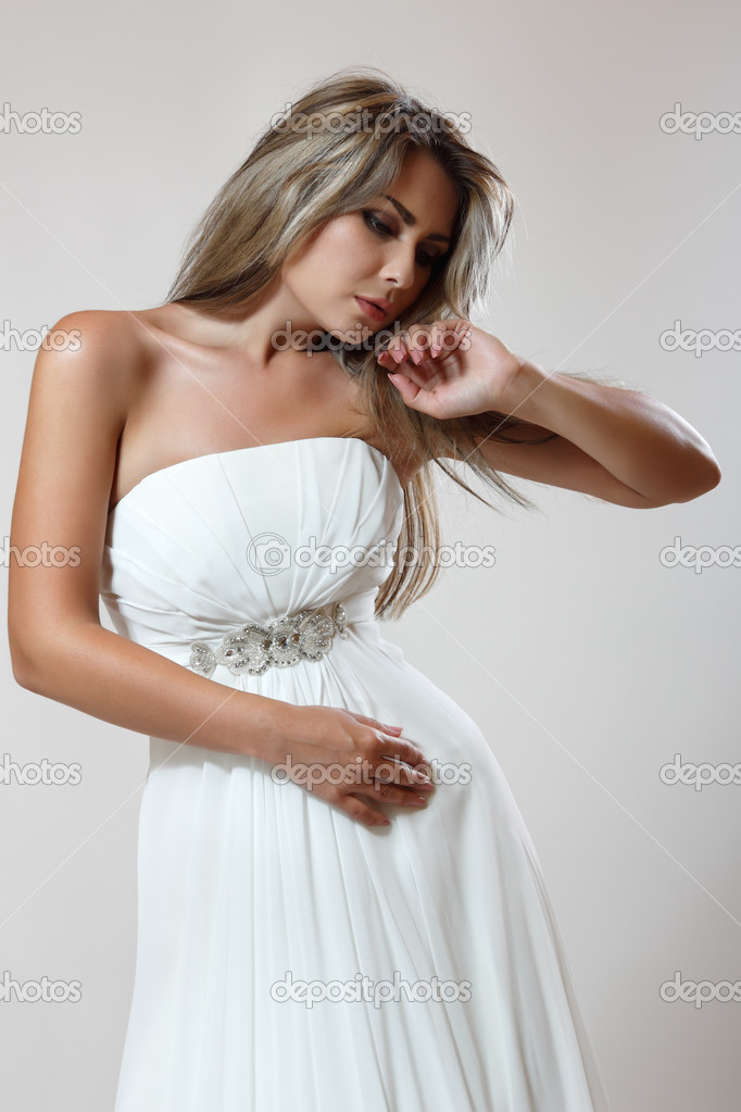Young woman in white dress