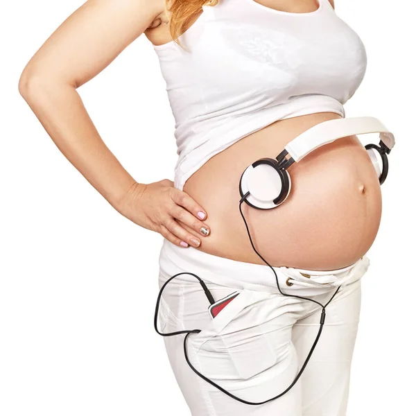 Mulher Grávida Com Fones Ouvido Sua Barriga Grande Posando Estúdio — Fotografia de Stock