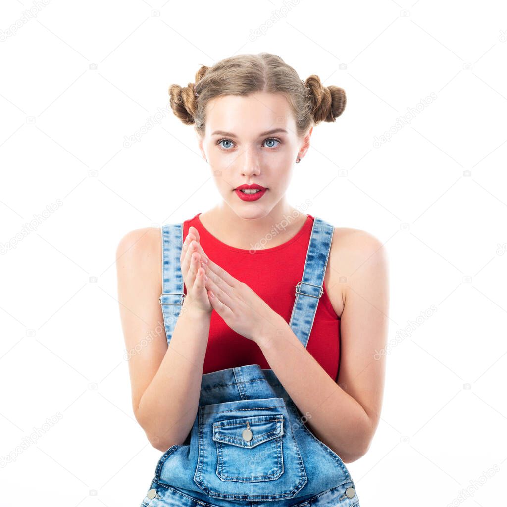 lBeautiful woman wearing red top and blue jeans posing at studio with worry, waiting, interest, concern human emotions, portrait over white background. 