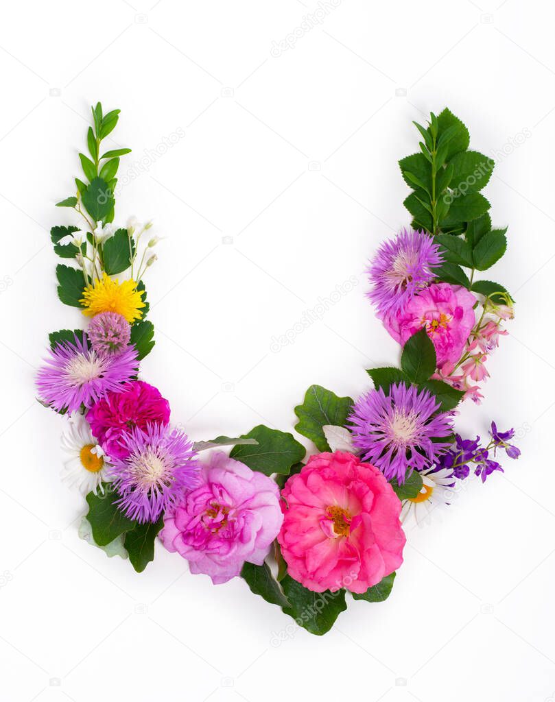 Floral summer font. Concept alphabet design, letter U. Seasonal decorative beautiful type mades of different multi-colored blooming flowers and grass. Natural summertime print