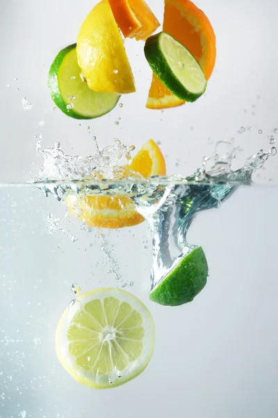 Lemon, lime and orange splash — Stock Photo, Image