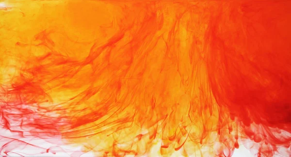 Red and yellow ink in water — Stock Photo, Image