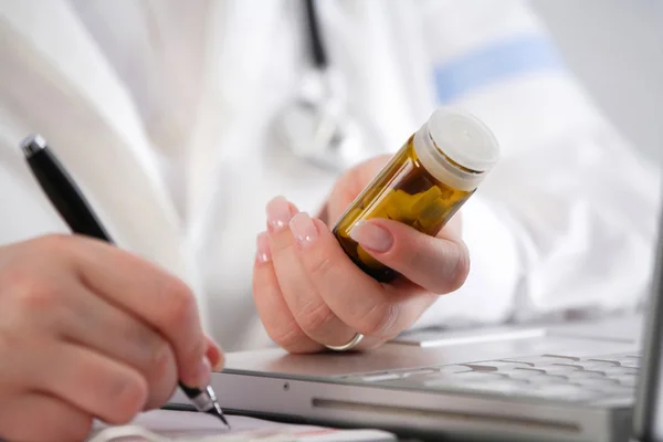 Doctor writing a prescription — Stock Photo, Image