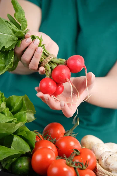 Woman holding fresh vegetables — Stock Photo, Image