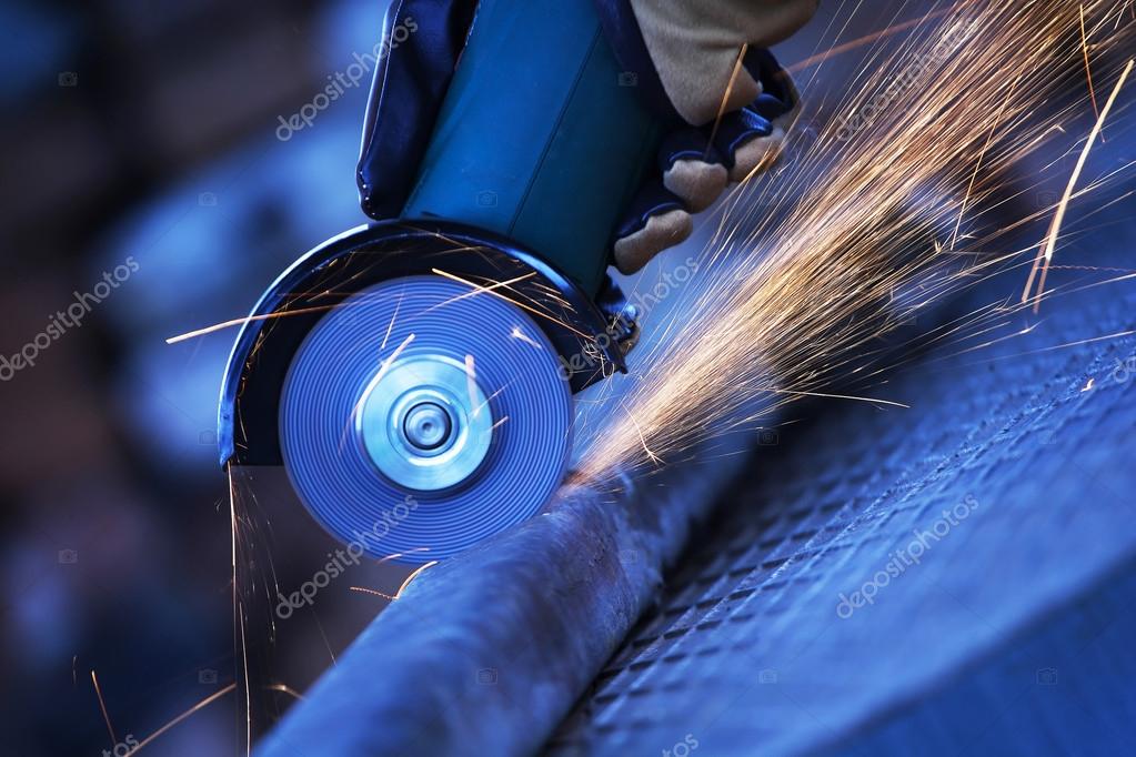 Angle grinder cutting steel — Stock Photo © EmiliaU 27275135