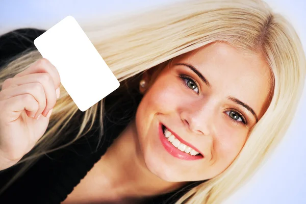 Woman holding a blank card — Stock Photo, Image