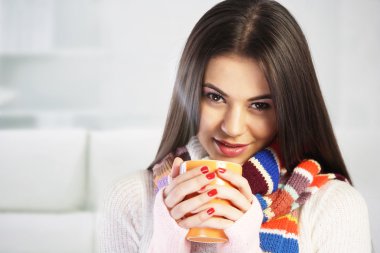Young woman drinking tea clipart