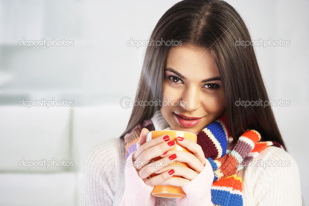 Young woman drinking tea