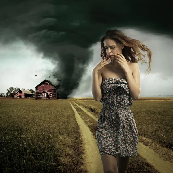 Tornado destroying a woman's house — Stock Photo, Image