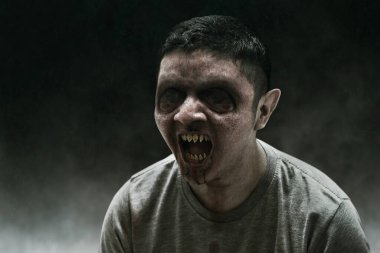 Evil scary ghost on dark background