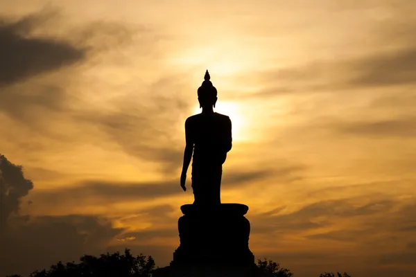 Будда на заході сонця . Стокове Зображення