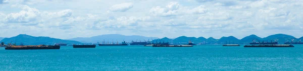 stock image panorama cargo ship in sea at day.