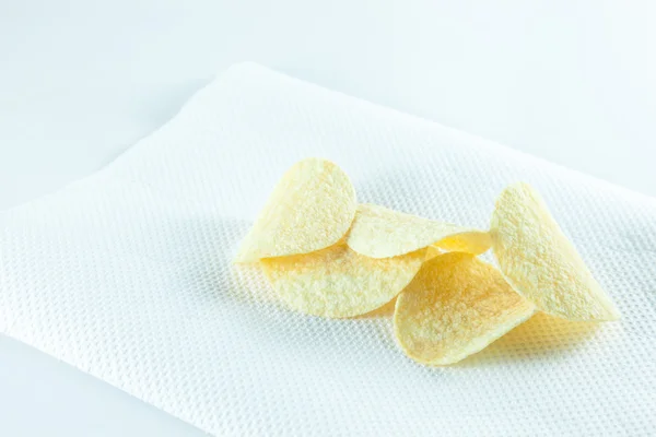 Potato chips on tissue. — Stock Photo, Image
