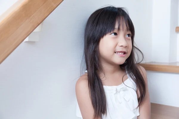 Girl sitting in on the ladder — Stock Photo, Image