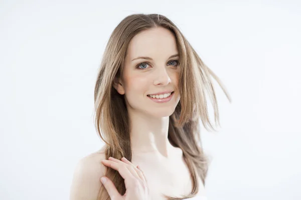 Beauty with windy hair on white — Stock Photo, Image