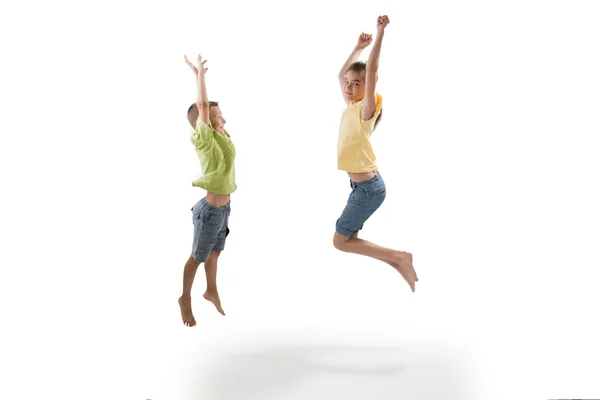 Two children jumping — Stock Photo, Image