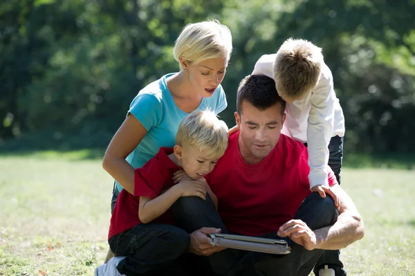 Family using PC tablet — Stock Photo, Image