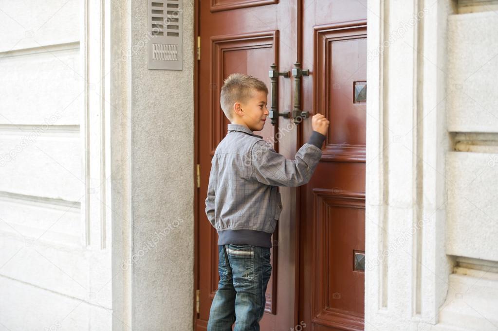 Boy knocking door