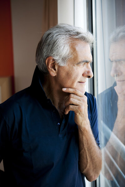 Senior man at the window