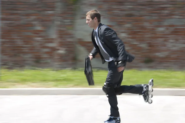 Businessman rollerblading — Stock Photo, Image