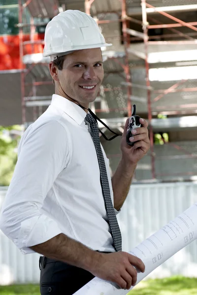 Construction worker with blueprints — Stock Photo, Image