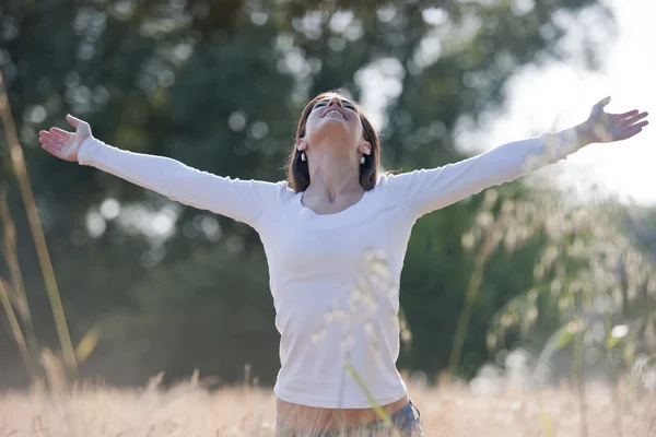 Young woman enjoying nature and freedom Stock Image