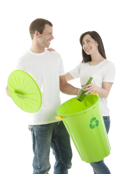 Young couple recycling glass bottles