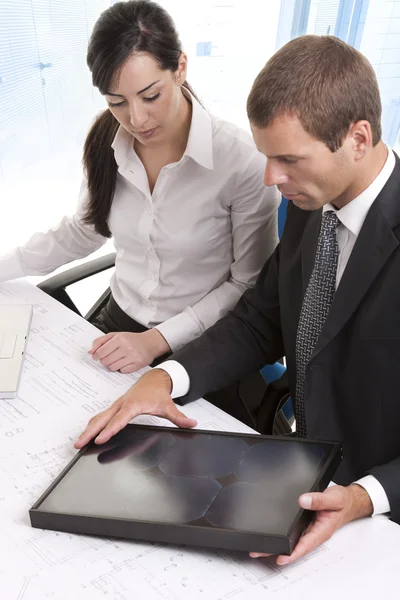 Business people wiht a small solar panel — Stock Photo, Image