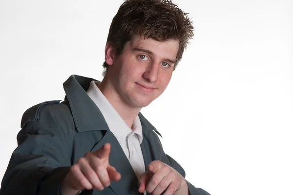 Young man in trench coat — Stock Photo, Image