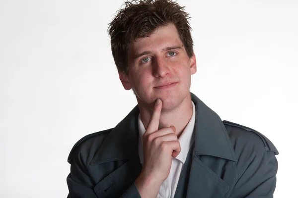 Young man in trench coat — Stock Photo, Image