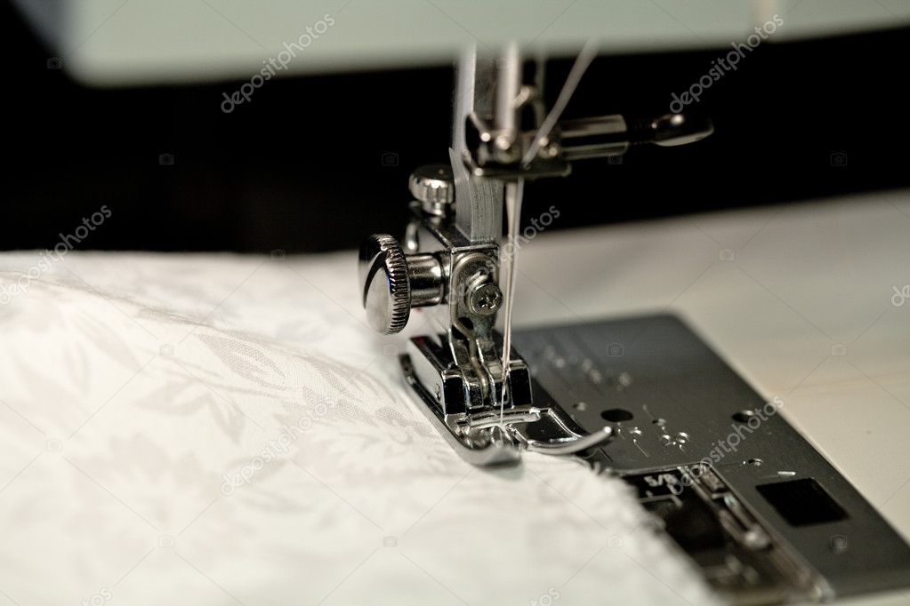Sewing needles on a white cloth