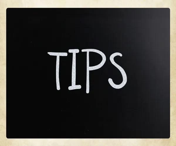 "Tips" handwritten with white chalk on a blackboard — Stock Photo, Image
