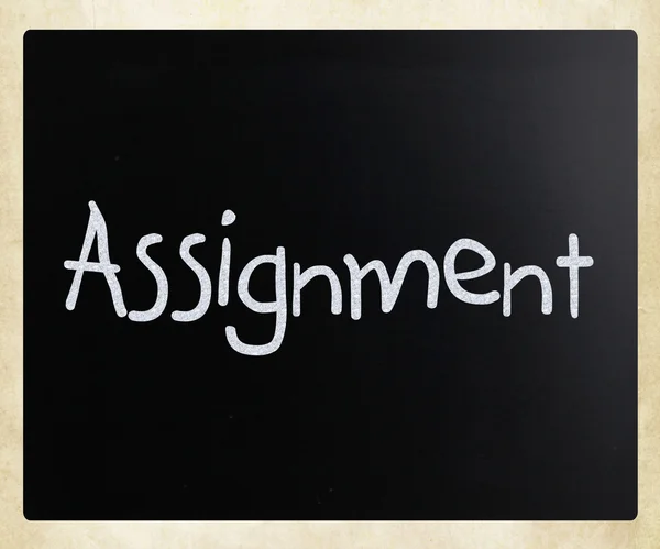"Assignment" handwritten with white chalk on a blackboard — Stock Photo, Image