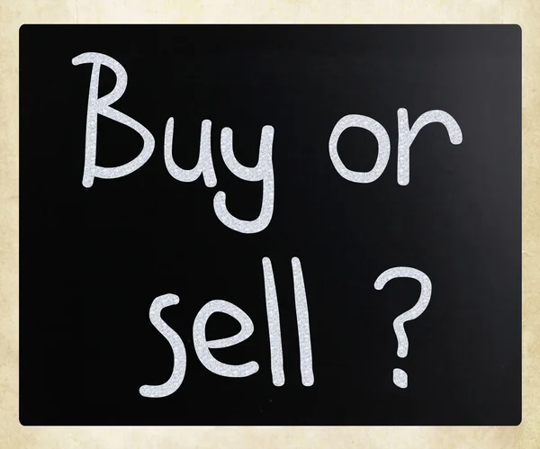 "Buy or sell" handwritten with white chalk on a blackboard — Stock Photo, Image