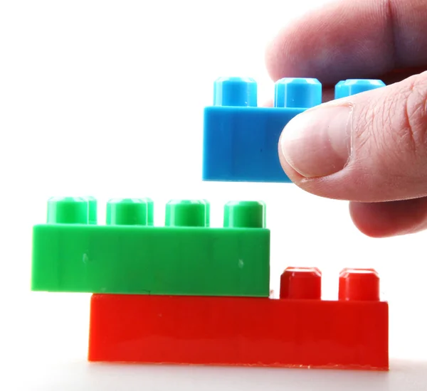 Color childish blocks to the building — Stock Photo, Image