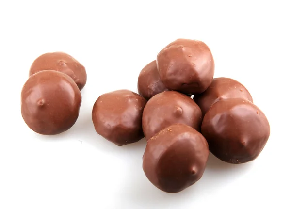 Stacked chocolate candy on white background — Stock Photo, Image