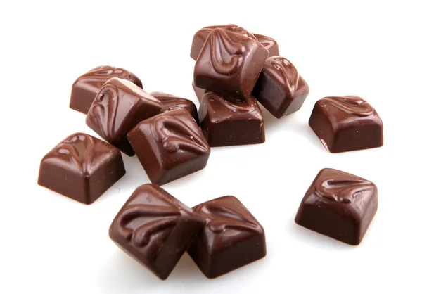 Caramelo de chocolate apilado sobre fondo blanco —  Fotos de Stock