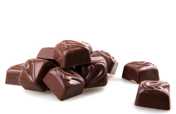 Halmozott csokoládé, a fehér háttér — Stock Fotó